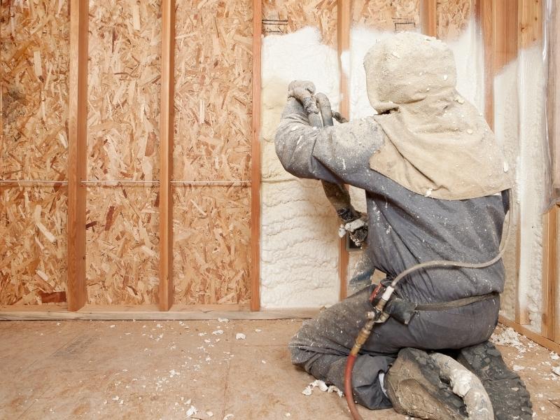 Spraying Expandable Foam Insulation between Wall Studs